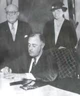 Franklin D. Roosevelt signing the National Labor Relations Act on July 5, 1935